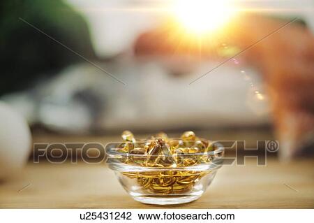 Stock Image - Vitamin D gel capsules. Fotosearch