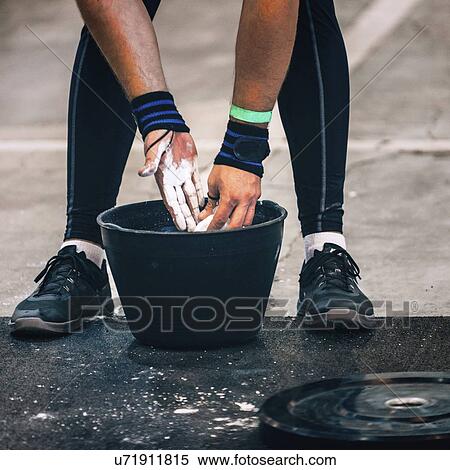 Weightlifter getting ready View Large Photo Image Stock Photography - Weightlifter getting ready. Fotosearch