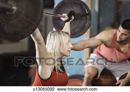 Stock Image - Weightlifting training. Fotosearch