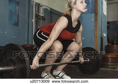 Stock Photo - Weightlifting training. Fotosearch