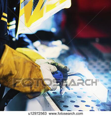 Welder at work View Large Photo Image Stock Image - Welder at work. Fotosearch