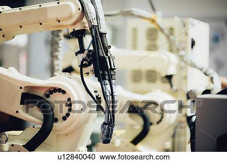 Stock Image - Welding robot. Fotosearch