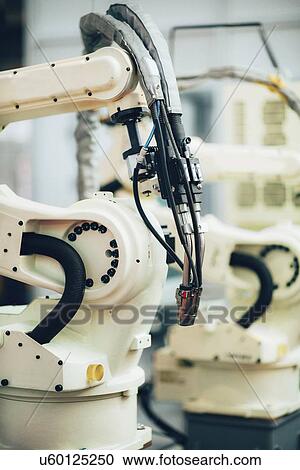 Stock Image - Welding robot. Fotosearch