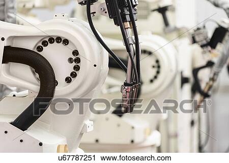 Stock Image - Welding robot. Fotosearch