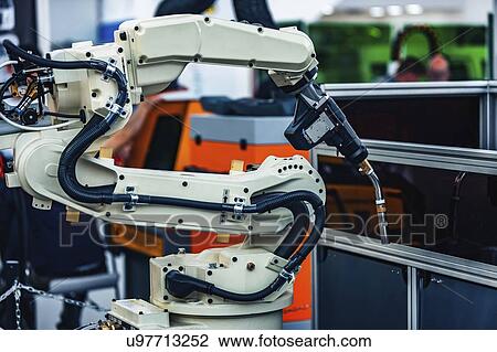 Stock Image - Welding robot. Fotosearch