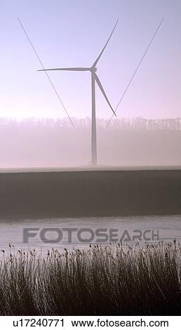 Stock Image - Wind turbine by River Trent, England.. Fotosearch