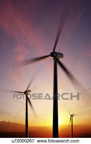 Stock Photo - Wind turbines at sunset, illustration.. Fotosearch