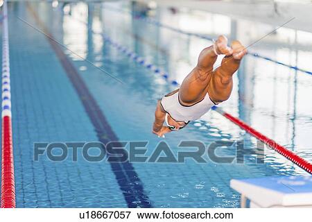 Woman diving into pool View Large Photo Image Stock Photo - Woman diving into pool. Fotosearch