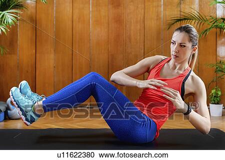 Woman doing abdominal exercises View Large Photo Image Stock Image - Woman doing abdominal exercises. Fotosearch