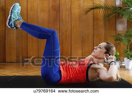 Picture - Woman doing Crunches. Fotosearch
