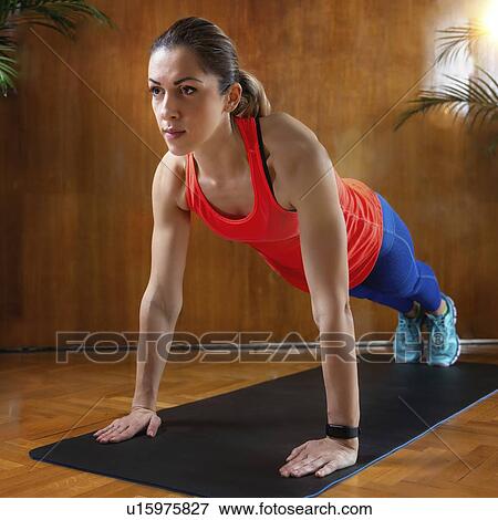Stock Photo - Woman doing High Plank. Fotosearch