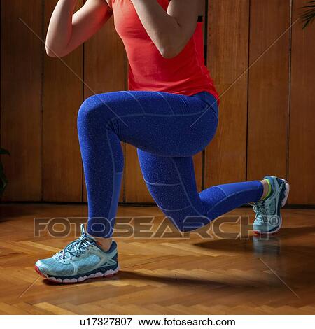 Woman doing lunges View Large Photo Image Stock Photo - Woman doing lunges. Fotosearch
