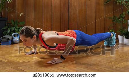 Woman doing Push-ups View Large Photo Image Stock Photography - Woman doing Push-ups. Fotosearch