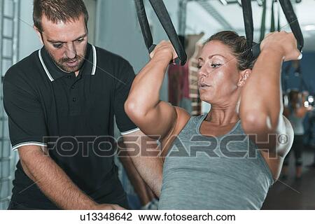 Woman doing TRX workout View Large Photo Image Stock Image - Woman doing TRX workout. Fotosearch
