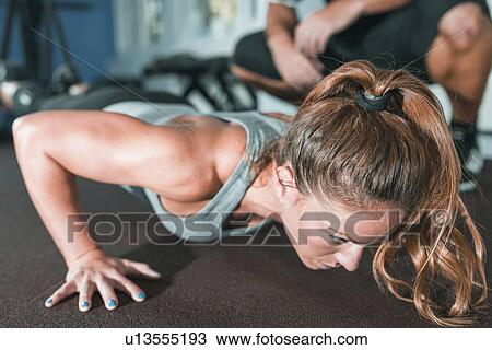 Woman doing TRX workout View Large Photo Image Stock Image - Woman doing TRX workout. Fotosearch