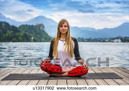 Woman doing yoga by a lake View Large Photo Image Stock Image - Woman doing yoga by a lake. Fotosearch