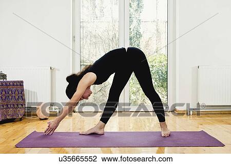 Stock Image - Woman doing yoga. Fotosearch