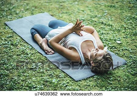 Stock Image - Woman doing yoga. Fotosearch