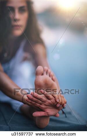 Woman doing yoga View Large Photo Image Stock Photo - Woman doing yoga. Fotosearch
