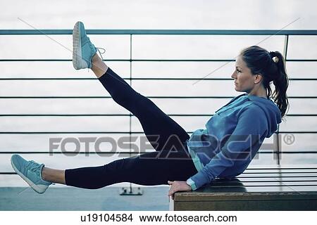 Picture - Woman exercising outside. Fotosearch