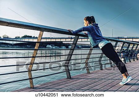 Woman exercising outside View Large Photo Image Stock Image - Woman exercising outside. Fotosearch