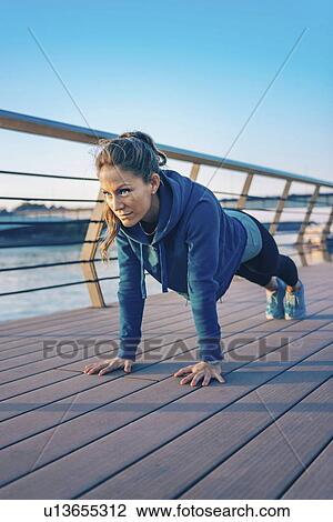 Woman exercising outside View Large Photo Image Stock Image - Woman exercising outside. Fotosearch