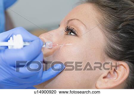 Woman having hyaluronic acid injections View Large Photo Image Stock Image - Woman having hyaluronic acid injections. Fotosearch