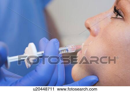 Woman having hyaluronic acid injections View Large Photo Image Stock Image - Woman having hyaluronic acid injections. Fotosearch