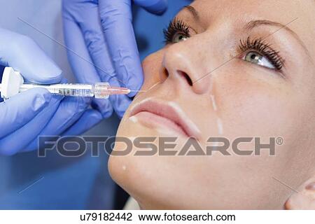 Woman having hyaluronic acid injections View Large Photo Image Stock Image - Woman having hyaluronic acid injections. Fotosearch