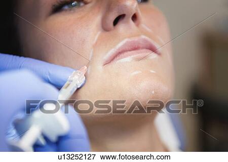 Woman having hyaluronic acid injections View Large Photo Image Stock Photo - Woman having hyaluronic acid injections. Fotosearch