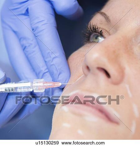 Woman having hyaluronic acid injections View Large Photo Image Stock Photo - Woman having hyaluronic acid injections. Fotosearch