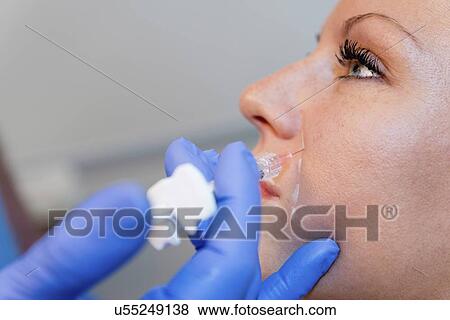 Woman having hyaluronic acid injections View Large Photo Image Stock Photo - Woman having hyaluronic acid injections. Fotosearch
