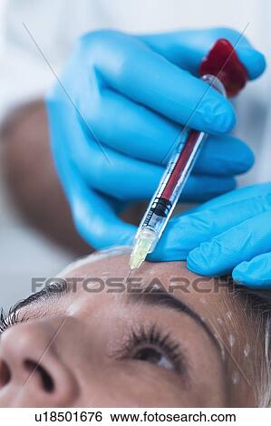 Woman having hyaluronic acid injections View Large Photo Image Stock Photograph - Woman having hyaluronic acid injections. Fotosearch