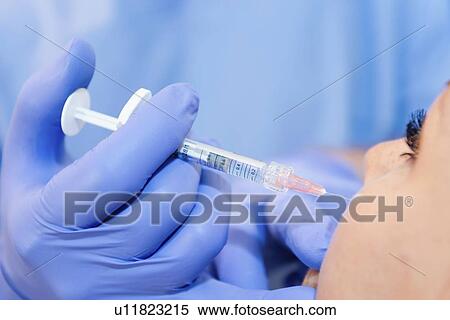 Woman having hyaluronic acid injections View Large Photo Image Stock Photography - Woman having hyaluronic acid injections. Fotosearch