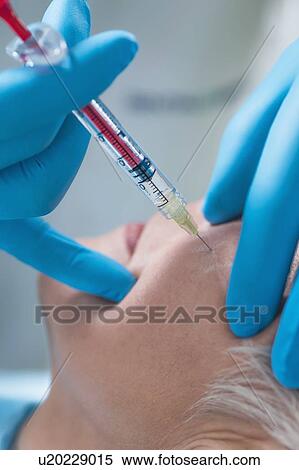 Woman having hyaluronic acid injections View Large Photo Image Stock Photography - Woman having hyaluronic acid injections. Fotosearch
