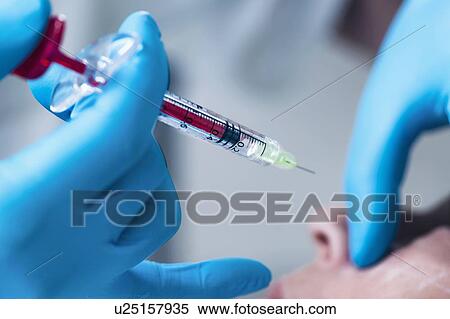 Stock Photography - Woman having hyaluronic acid injections. Fotosearch