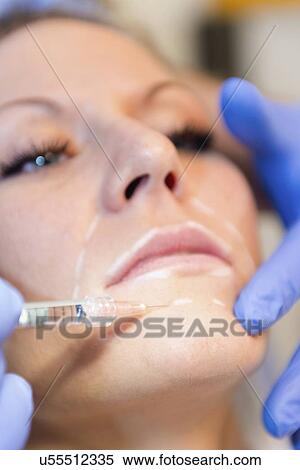Woman having hyaluronic acid injections View Large Photo Image Stock Photography - Woman having hyaluronic acid injections. Fotosearch