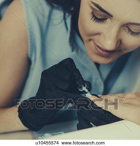 Woman having manicure View Large Photo Image Picture - Woman having manicure. Fotosearch