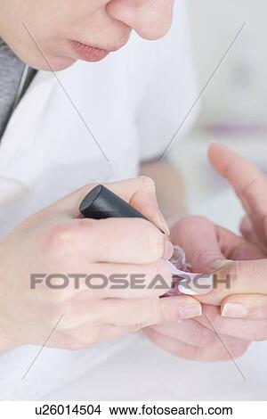 Woman having manicure View Large Photo Image Picture - Woman having manicure. Fotosearch