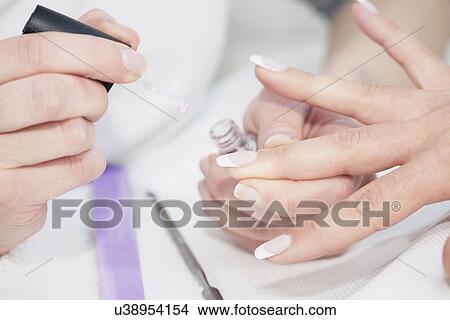 Woman having manicure View Large Photo Image Picture - Woman having manicure. Fotosearch