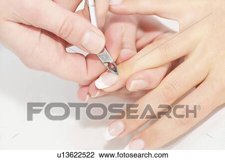 Woman having manicure View Large Photo Image Stock Image - Woman having manicure. Fotosearch