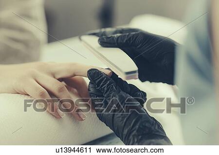 Woman having manicure View Large Photo Image Stock Image - Woman having manicure. Fotosearch