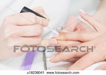 Woman having manicure View Large Photo Image Stock Image - Woman having manicure. Fotosearch