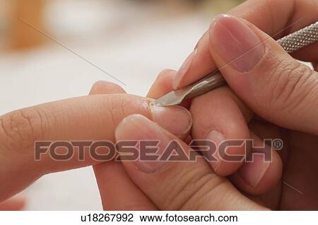 Woman having manicure View Large Photo Image Stock Image - Woman having manicure. Fotosearch