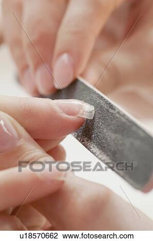 Woman having manicure View Large Photo Image Stock Image - Woman having manicure. Fotosearch