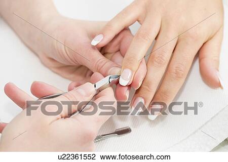 Stock Image - Woman having manicure. Fotosearch