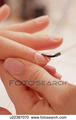 Woman having manicure View Large Photo Image Stock Image - Woman having manicure. Fotosearch
