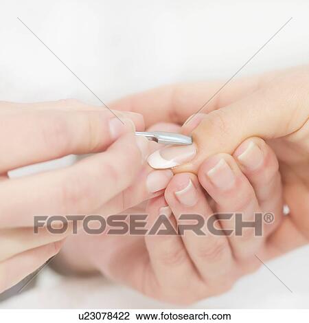 Woman having manicure View Large Photo Image Stock Image - Woman having manicure. Fotosearch