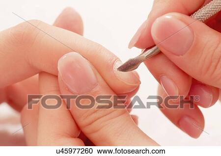 Woman having manicure View Large Photo Image Stock Image - Woman having manicure. Fotosearch