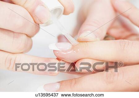 Stock Photo - Woman having manicure. Fotosearch
